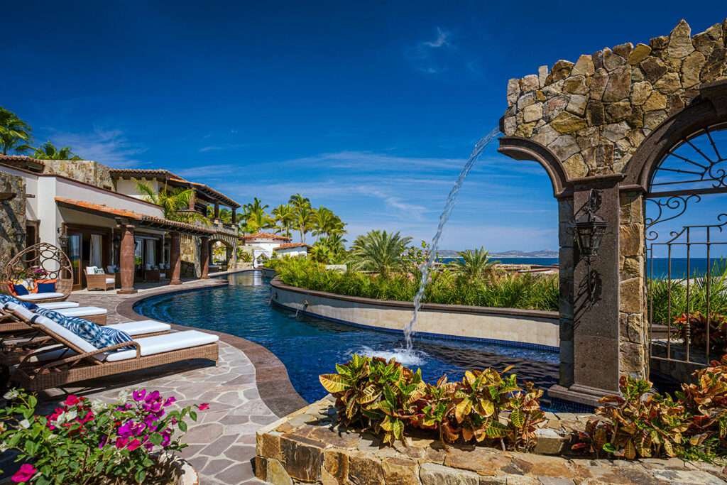 Four Seasons Cabo Rancholasmargaritas Casa Playa Escondida - Oceanfront Luxury in Baja California SurPerched dramatically on the rocks above the Pacific Ocean, Casa Playa Escondida is a rare oceanfront retreat set along a secluded, pristine stretch of beach. Located within the exclusive off-grid gated community of Rancho Las Margaritas, this one-of-a-kind property offers privacy, tranquility, and breathtaking natural beauty--just a 20-minute drive to the dining and shopping of Cabo San Lucas, 40 minutes from Los Cabos International Airport, and approximately 30 minutes south of Cerritos and Todos Santos.The residence features three spacious ensuite bedrooms, each privately situated yet connected by terraces, pathways, and shared gathering spaces. A dedicated media room offers flexibility as a fourth bedroom or additional guest suite.Expansive terraces and multiple lounging areas provide a variety of vantage points to take in the surrounding landscape, from the rugged coastline to the endless Pacific horizon.The gourmet kitchen is equipped with high-end appliances and designed for both functionality and style. A warm and inviting living and dining area, anchored by a striking fireplace, creates the perfect space for entertaining or relaxing with family and friends. The home is offered fully furnished with includes modern off-grid conveniences such as solar power.Outdoor living is equally exceptional, featuring a swimming pool, firepit, grilling area, and multiple seating spaces--ideal for enjoying the serene coastal setting – Villa Encanto, Palmilla Cove 5, San Jose Corridor, San Jose Corridor, BS