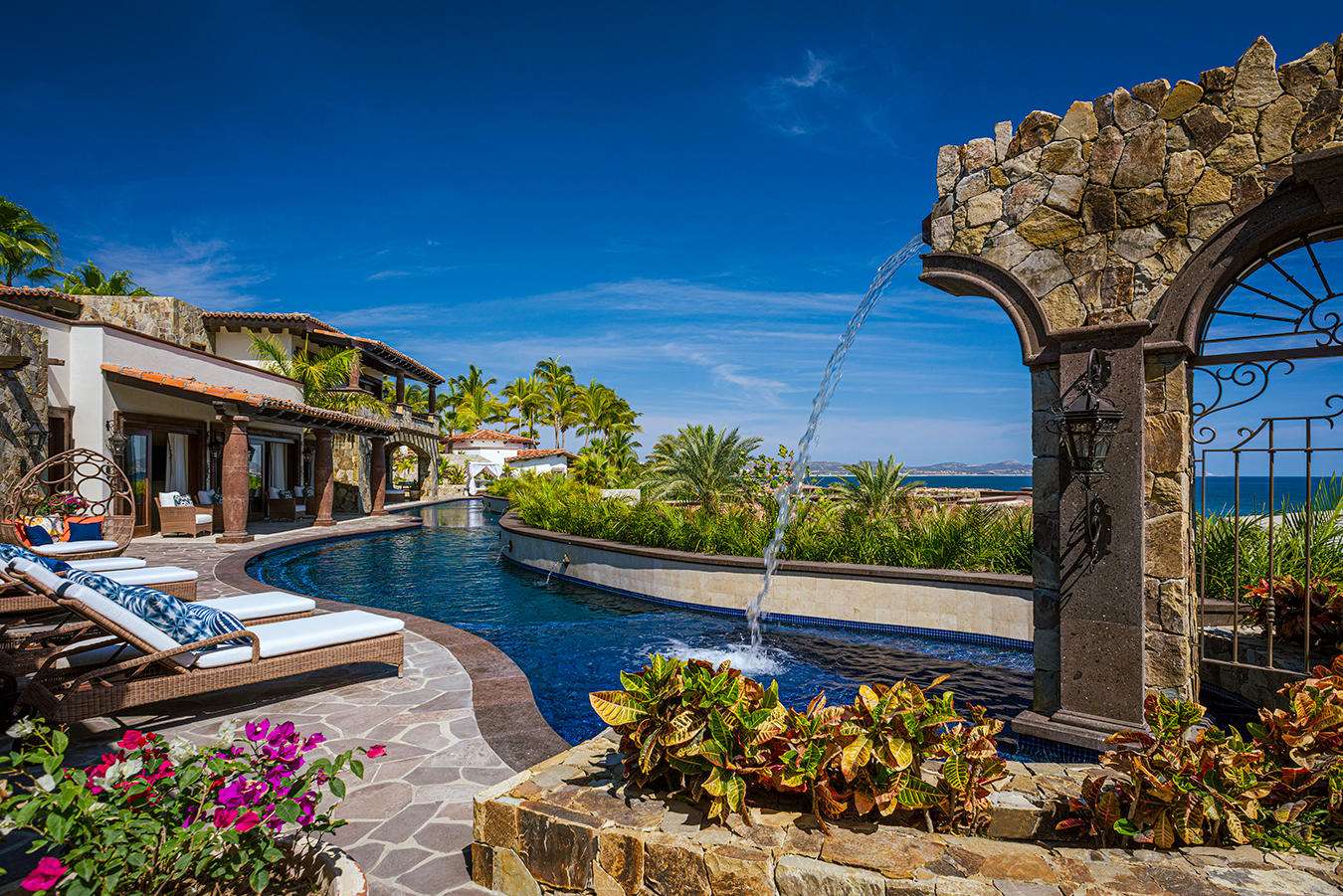 Four Seasons Cabo Rancholasmargaritas Casa Playa Escondida - Oceanfront Luxury in Baja California SurPerched dramatically on the rocks above the Pacific Ocean, Casa Playa Escondida is a rare oceanfront retreat set along a secluded, pristine stretch of beach. Located within the exclusive off-grid gated community of Rancho Las Margaritas, this one-of-a-kind property offers privacy, tranquility, and breathtaking natural beauty--just a 20-minute drive to the dining and shopping of Cabo San Lucas, 40 minutes from Los Cabos International Airport, and approximately 30 minutes south of Cerritos and Todos Santos.The residence features three spacious ensuite bedrooms, each privately situated yet connected by terraces, pathways, and shared gathering spaces. A dedicated media room offers flexibility as a fourth bedroom or additional guest suite.Expansive terraces and multiple lounging areas provide a variety of vantage points to take in the surrounding landscape, from the rugged coastline to the endless Pacific horizon.The gourmet kitchen is equipped with high-end appliances and designed for both functionality and style. A warm and inviting living and dining area, anchored by a striking fireplace, creates the perfect space for entertaining or relaxing with family and friends. The home is offered fully furnished with includes modern off-grid conveniences such as solar power.Outdoor living is equally exceptional, featuring a swimming pool, firepit, grilling area, and multiple seating spaces--ideal for enjoying the serene coastal setting for sale