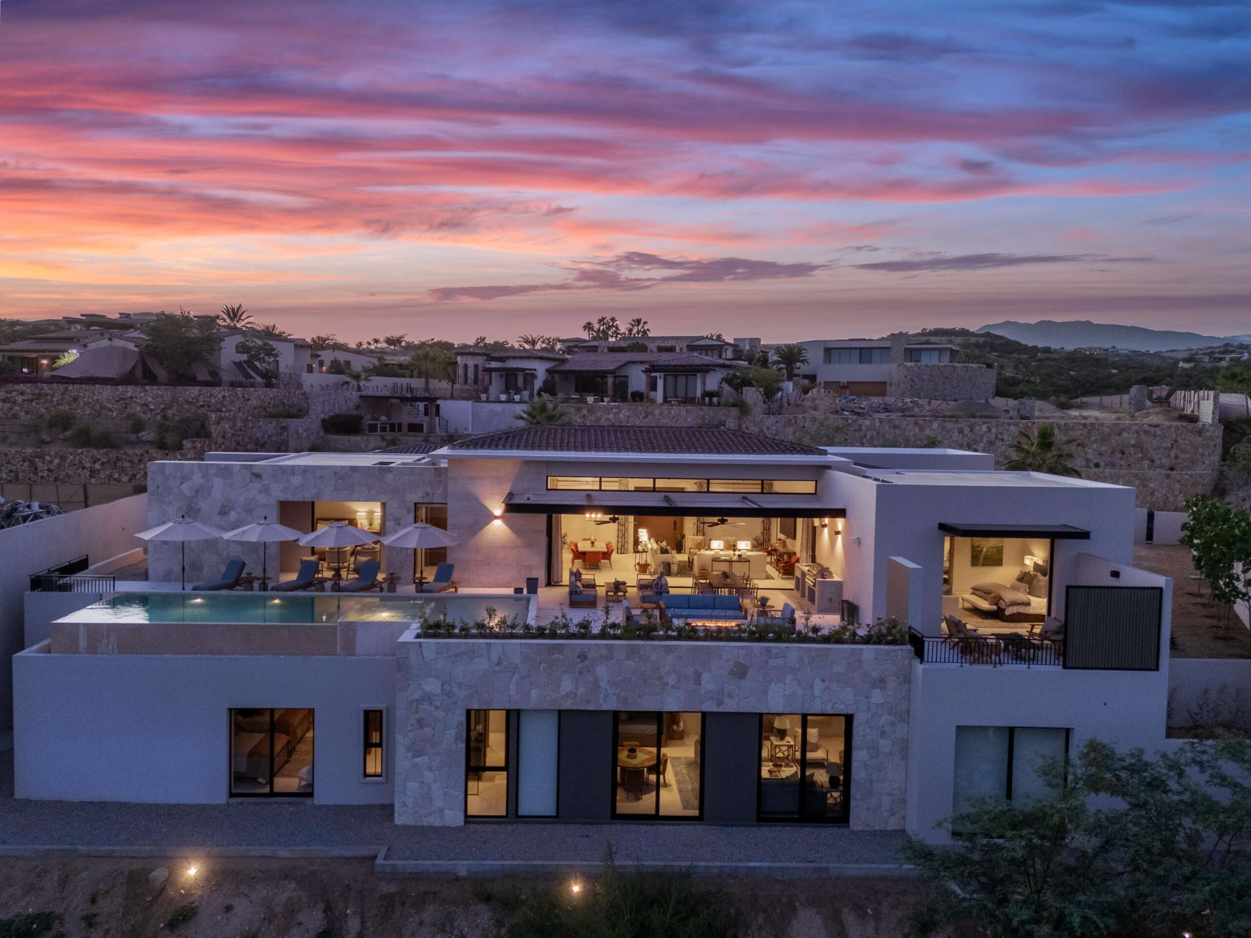Four Seasons Cabo Section 18- Horizontes Welcome to Horizontes 3, an exquisite custom-made home located within San José del Cabo's most sought-after community, Querencia. Surrounded by Tom Fazio's signature golf course, recognized as one of the best in the country, this stunning residence is just a short golf cart ride from the prestigious 5-star Club House. This remarkable 6-bedroom, 6.5-bathroom home elevates luxury living with a fresh vision of architecture and design. The layout features a cozy family room, an expansive bunk bed bedroom on the lower level, and a spacious maid's quarters with an independent entrance, making it ideal for entertaining family and friends.The property boasts outdoor living spaces, including tranquil green areas, an outdoor kitchen, an infinity pool, a jacuzzi, and ocean and ravine for sale