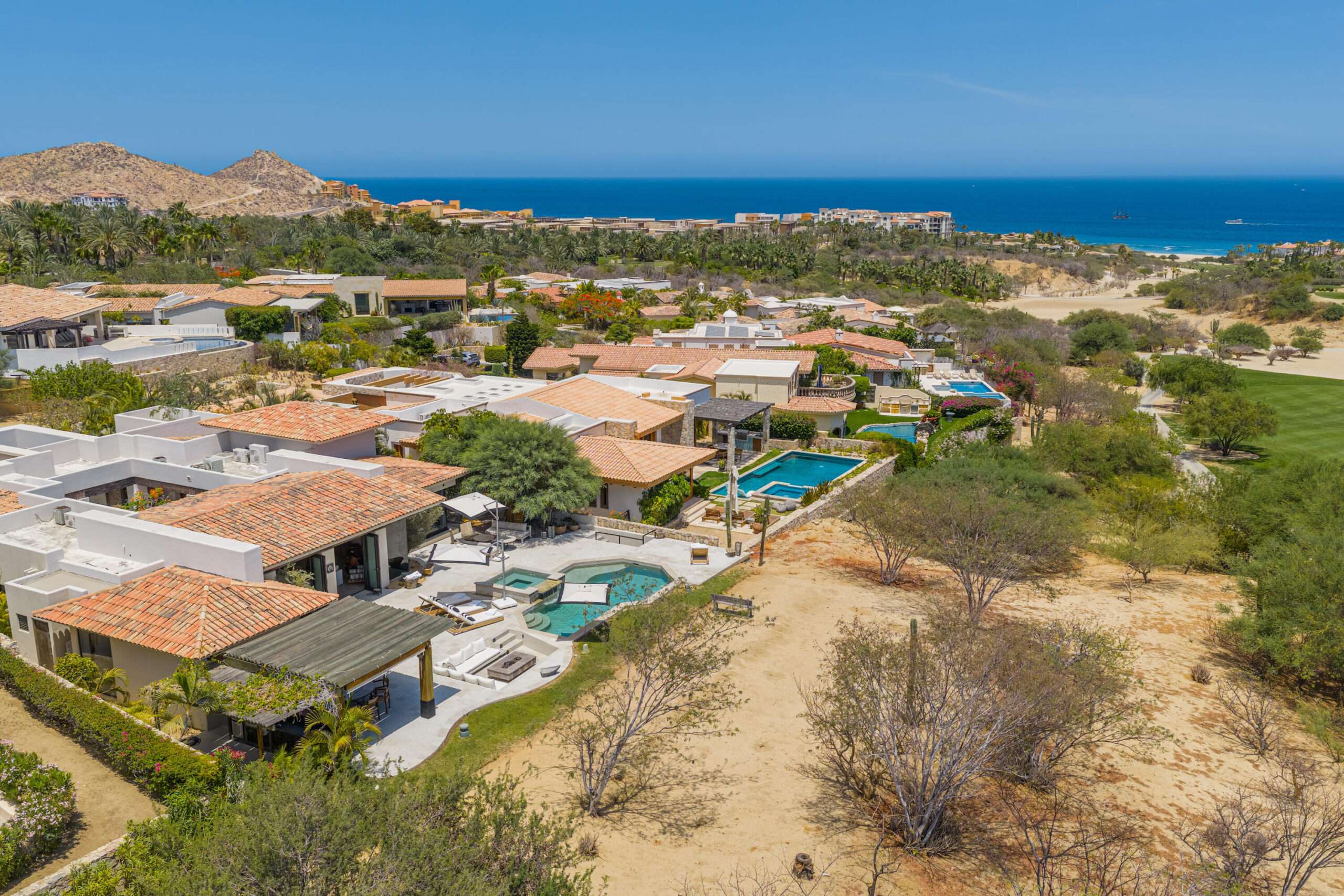 Four Seasons Cabo Brisas Discover Naah Payil, an exceptional estate where the warmth of a Contemporary Mexican Hacienda blends seamlessly with the relaxed sophistication of coastal living. Located within one of Los Cabos' most exclusive and secure communities, this architectural masterpiece was custom-designed by MCA, led by renowned architect Antonio Carrera. Thoughtfully enhanced in 2015 and again in 2025, the residence beautifully balances timeless character with today's highest standards of comfort and design. At the heart of the home, a central courtyard anchored by a signature tree creates a tranquil gathering space filled with natural light. The home's thoughtful design embraces effortless indoor-outdoor living. Open the grand living room doors, and refreshing ocean breezes naturally flow throughout the residence, creating a comfortable and inviting atmosphere – 12 Cabo del Sol Brisas, Cabo Corridor, BS